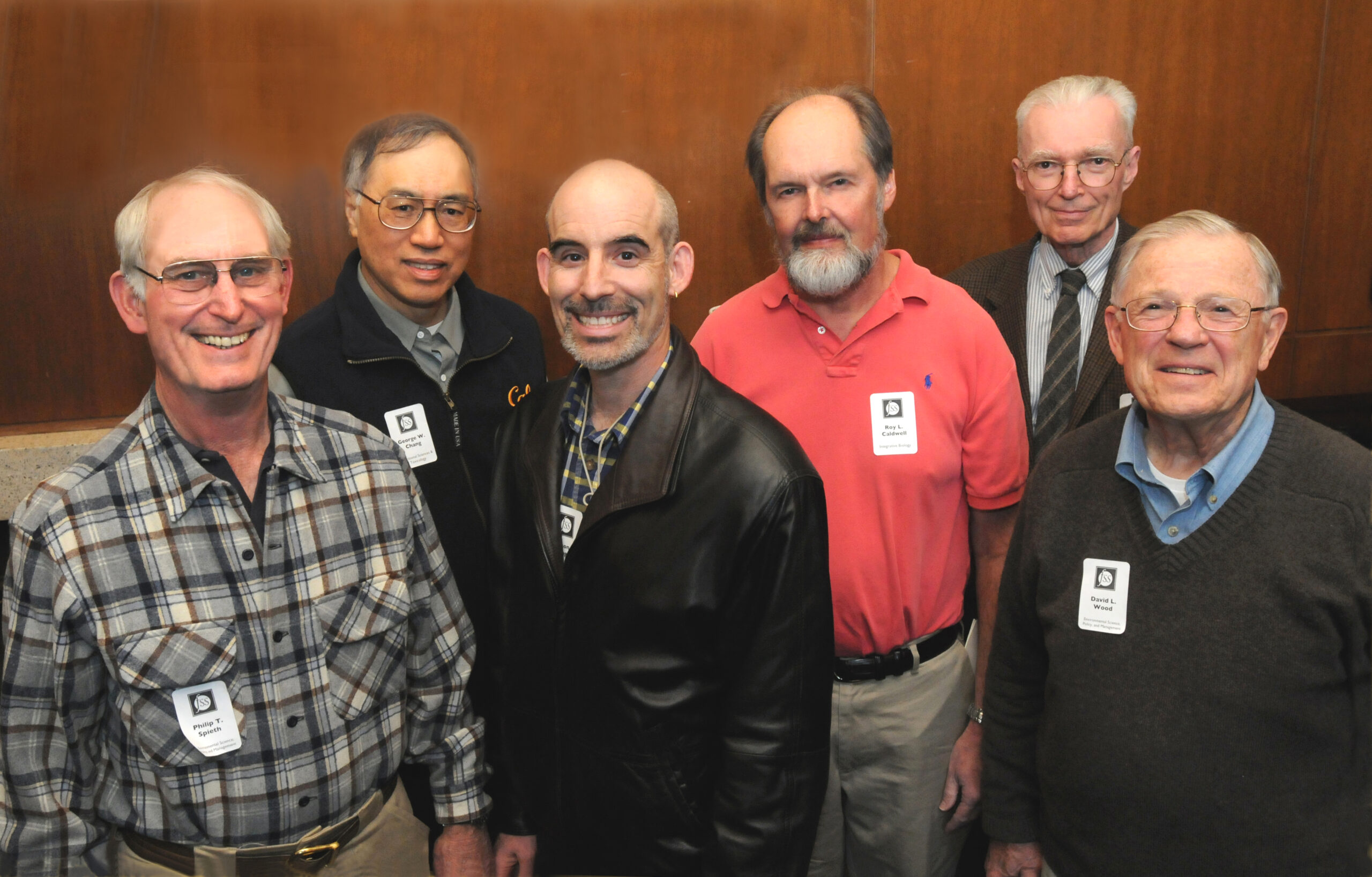 Six faculty members smiling