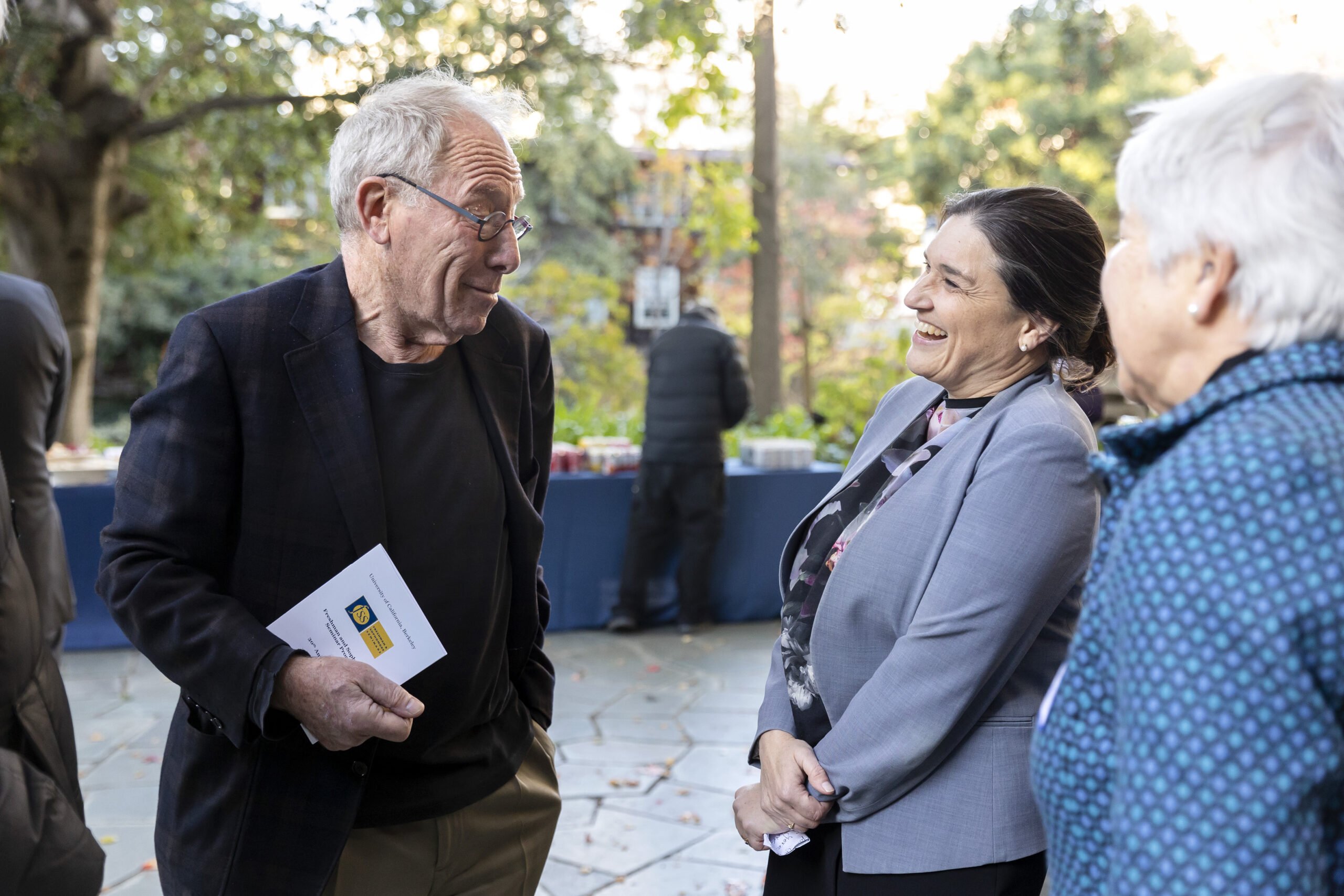 Three people smiling