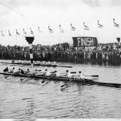 Black and white photo of men rowing